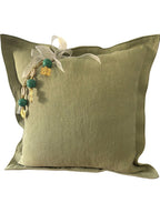 Coussin en lin pistache ZANZIBAR No.83 avec pampille signature MIYA et perles vert d'eau.