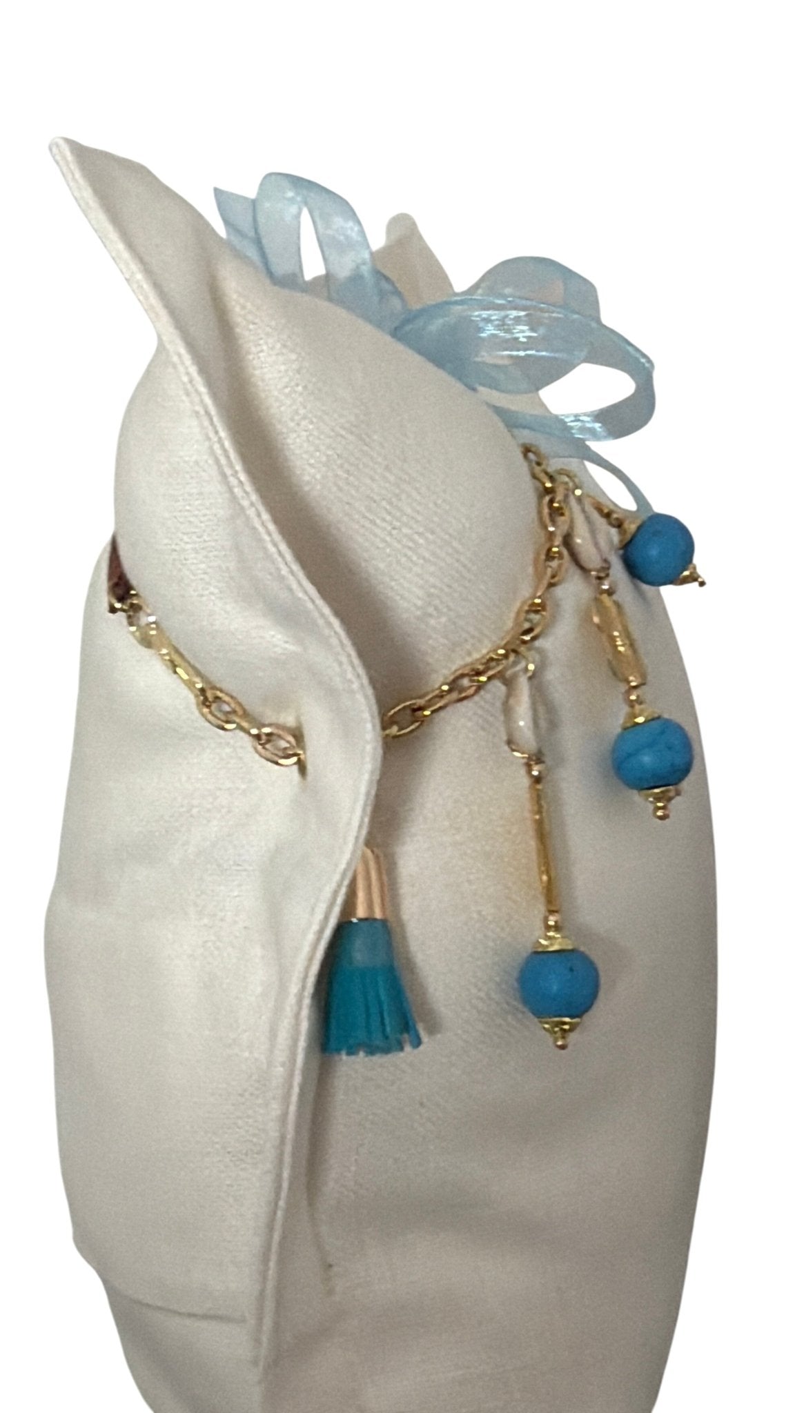 Coussin ZANZIBAR No.57 en lin lourd blanc et pampille turquoise artisanale.