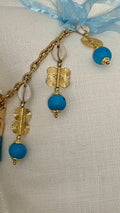 Détail de la pampille ZANZIBAR No.57 avec poids Ashanti et perles turquoise.