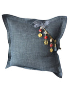 Bleu jean linen throw pillow with MIYA signature tassel featuring African beads and traditional Ashanti weights.