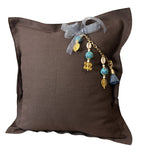 Chocolate heavyweight linen throw pillow with turquoise African bead tassel – MARRAKECH No.77 by MIYA