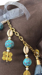Turquoise African bead tassel with Ashanti weights and cowrie shells – MARRAKECH No.77 by MIYA
