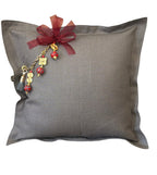 Grey heavy linen throw pillow with MIYA's signature tassel featuring red African beads and traditional Ashanti weights.