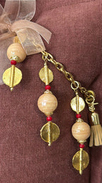 Counssin en lin terracotta MIYA perles chair et poids Ashanti. Zoom