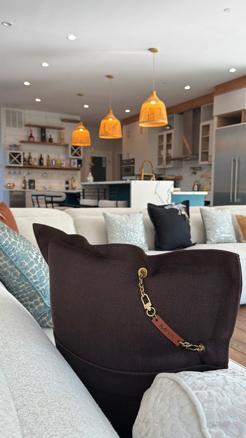 Modern living room with MIYA cushion on sofa with a view into open kitchen